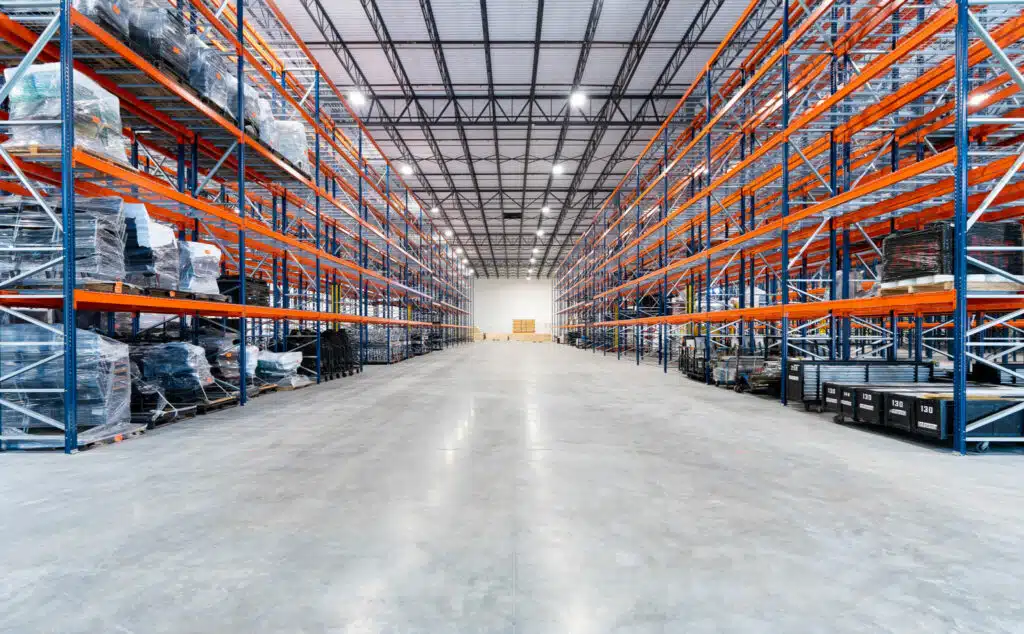 Wide central aisle showing operating clearances between pallet racks