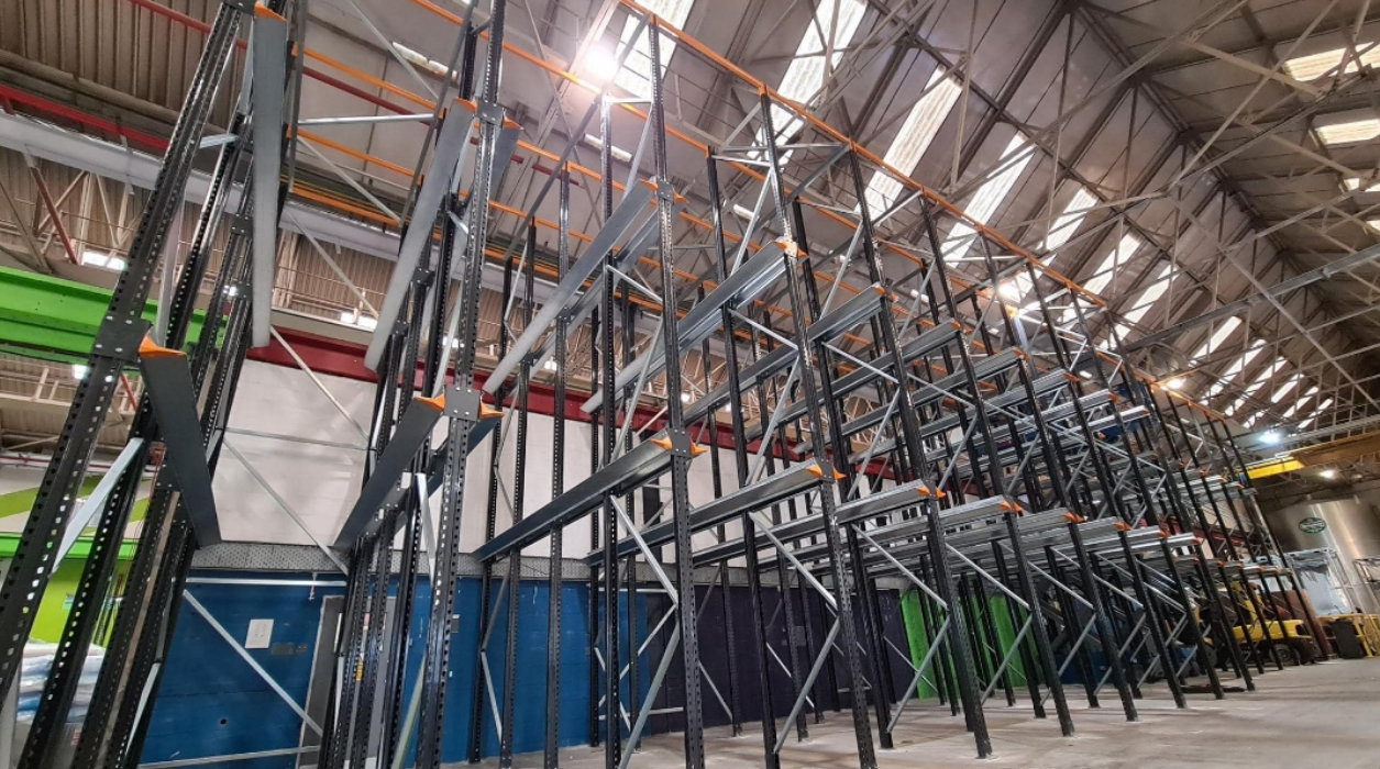 Drive-in pallet racking structure being installed during a warehouse upgrade